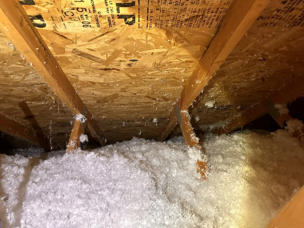 Attic insulation coverage across roof framing