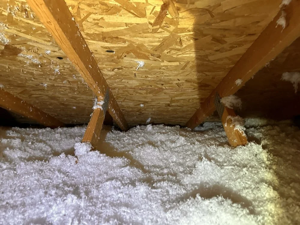 Insulation installed through an attic work area