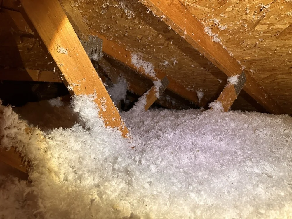 Attic insulation coverage around structural framing