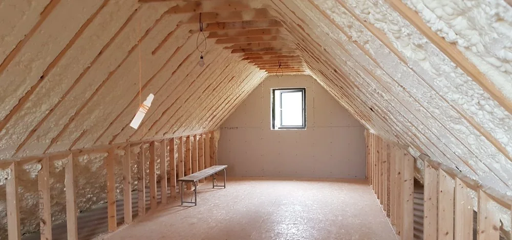 Finished spray foam insulation along an attic roof deck